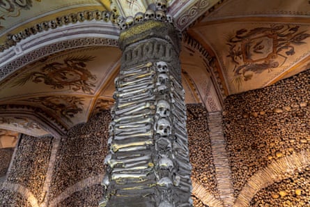 A column covered in skeletons in the Chapel of Bones