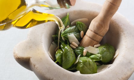 Making pesto with a mortar and pestle