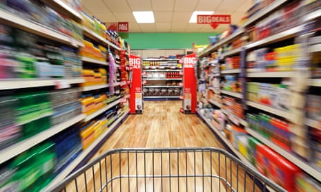 Shopping trolley speeding down a supermarket aisle