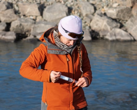 Marjolaine Verret takes water samples.