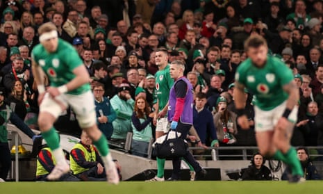 Ireland's Johnny Sexton goes off injured.
