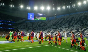 The players bring it to the park in front of the mosaic.