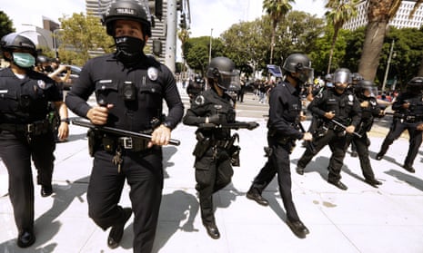 Los Angeles police officers in front of the LAPD headquarters in downtown Los Angeles during Covid protests.