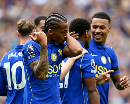 The Chelsea forward João Pedro kisses a tattoo on his left arm to celebrate scoring in his team's 4-3 home Premier League win against Brighton.