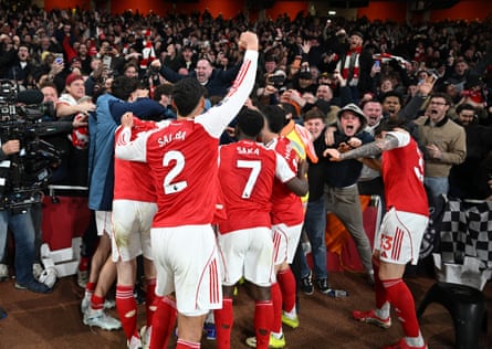 Arsenal players and fans celebrate