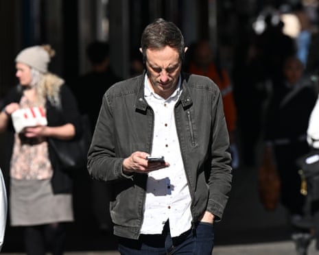 Person seen checking phone