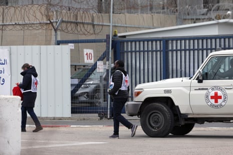 Members of the International Committee of the Red Cross (ICRC) arrive to the West Bank military prison of Ofer to receive Palestinians as part of an Israel-Hamas ceasefire deal, north of Jerusalem.