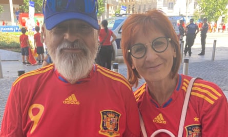 Pilar Martín and her partner, Manuel González, who are both wearing Spanish football tops