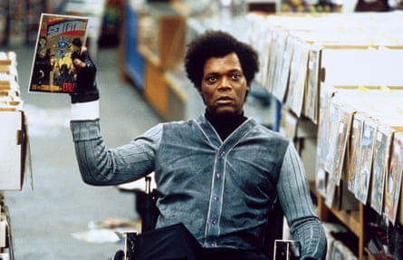 Samuel L Jackson holds up a comic book