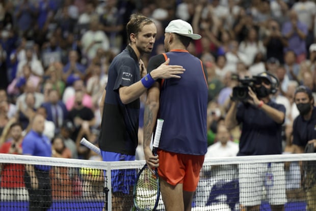 Medvedev congratulates Kyrgios at the net.