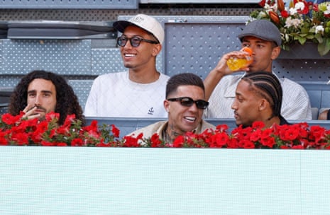 What, no Cliff Richard? (L-R) Marc Cucurella, Jobe Bellingham, Enzo Fernandez, Jude Bellingham, and Joao Pedro watch the Madrid Open.