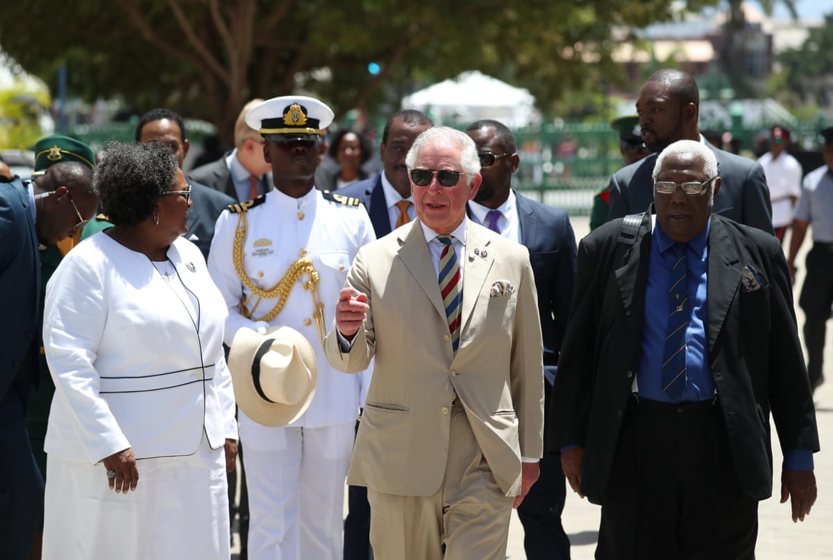 The then Prince of Wales on walkabout with the prime minister of Barbados, Mia Mottley, in Bridgetown, Barbados, during his 2019 tour of the Caribbean.