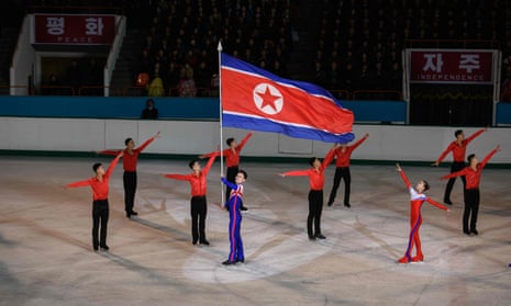 Olympic ice skater Kim Ju Sik (centre L) of North Korea holds a national flag during celebrations marking the birthday of late North Korean leader Kim Jong Il, in Pyongyang. North Korea will not attend the forthcoming Olympic Games in Tokyo, Pyongyang’s sports ministry said on 6 April 2021, citing the risks of coronavirus infection. 