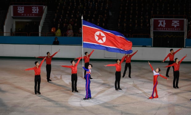 Olympic ice skater Kim Ju Sik (centre L) of North Korea holds a national flag during celebrations marking the birthday of late North Korean leader Kim Jong Il, in Pyongyang. North Korea will not attend the forthcoming Olympic Games in Tokyo, Pyongyang’s sports ministry said on 6 April 2021, citing the risks of coronavirus infection. 