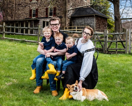 Malcolm and Simone Collins with their children Octavian, Torsten and Titan, alongside their dog, The Professor, in Eagleville, Pennsylvania.