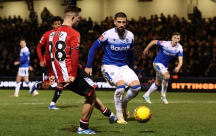 James McAtee slots in the first of his late double at Gillingham