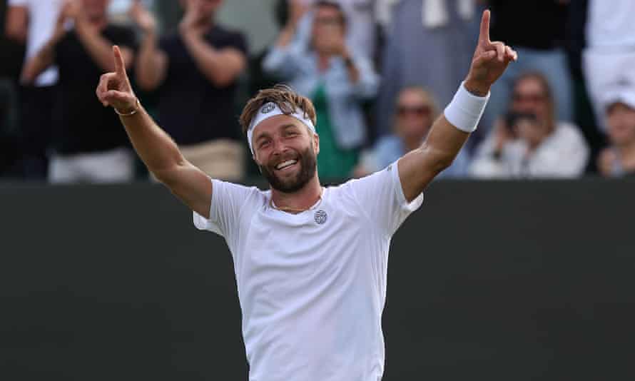 Liam Broady celebrates defeating Diego Schwartzman in his second-round match at Wimbledon.