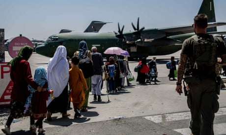 Afghans fleeing their country are evacuated from Kabul airport after the Taliban take control of the city.