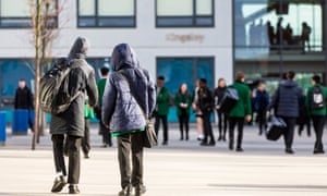 Two students walk into school