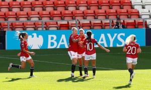 Manchester United celebrate Leah Galton’s equaliser.