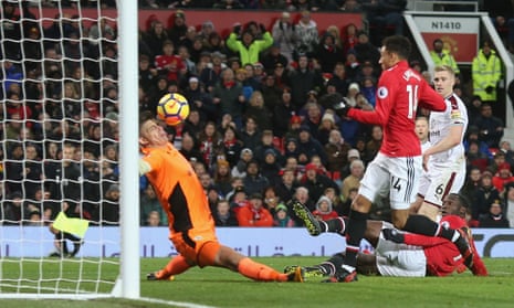 Jesse Lingard of Manchester United has a shot tipped onto the bar by Nick Pope’s schnozzle.