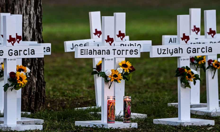 Crosses adorn a makeshift memorial for the shooting victims at Robb elementary school in Uvalde, Texas.