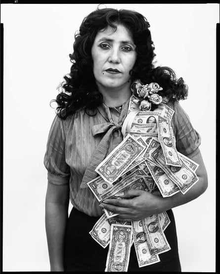 A woman with a cascade of dollar bills falling over one shoulder