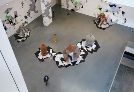 People walk around the atrium as MoMA reopens its doors on 27 August.