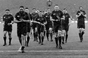 The All Blacks come off the pitch after their narrow victory against South Africa