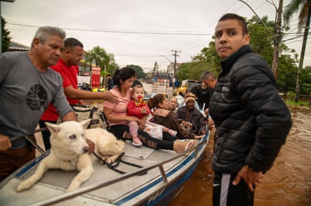 People are evacuated from a flooded area in Porto Alegre, Rio Grande do Sul State, Brazil. The death toll from floods and mudslides triggered by torrential storms in southern Brazil has climbed to 58 people.