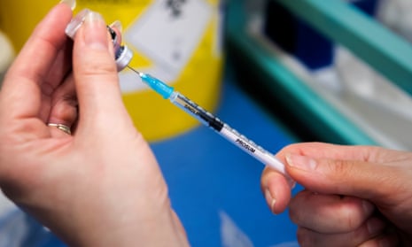 A nurse in Lancashire draws up a dose of the Pfizer Covid vaccine