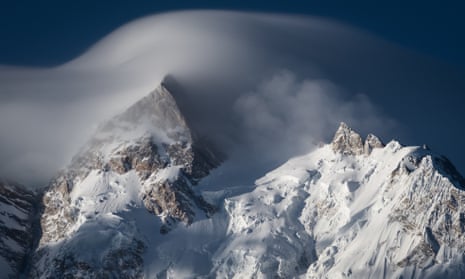 North peak of Nanga Parbat moutain massif covered by cloud