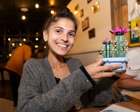 Adult Lego Fans gather at the Old London Road Cafe in Kingston. Loretta Piare holds up her completed Lego Cactus.