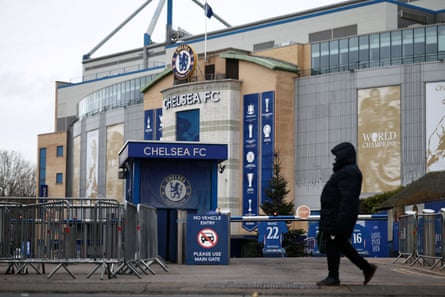 A pedestrian walks outside Stamford Bridge, Chelsea's stadium
