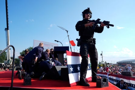 an armed soldier stands