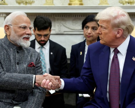 Narendra Modi and Donald Trump shaking hands at the White House on 13 February.