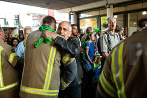 A man thanks a firefighter along the route