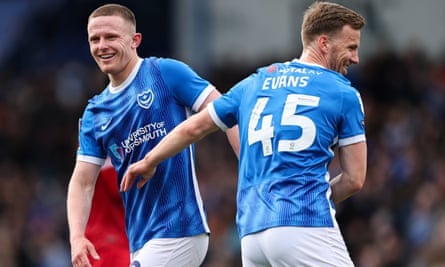 Colby Bishop (left) and Lee Evans enjoy a laugh during their 3-1 home win against Shrewsbury in early April