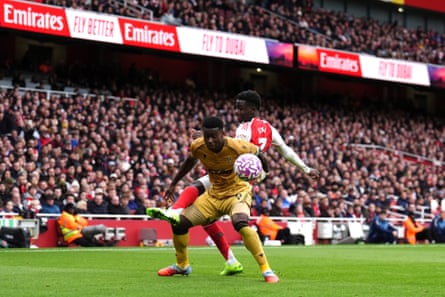 Crystal Palace’s Marc Guéhi holds off Bukayo Saka at the Emirates