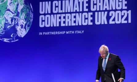 Boris Johnson leaves the stage after delivering a speech during the opening ceremony of Cop26.