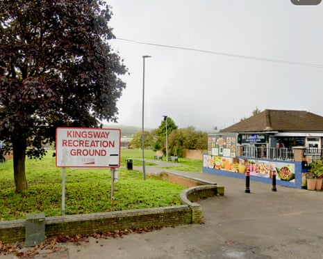 A sign reading 'Kingsway Recreation Ground' stands beside a path leading to a recreation ground with a cafe