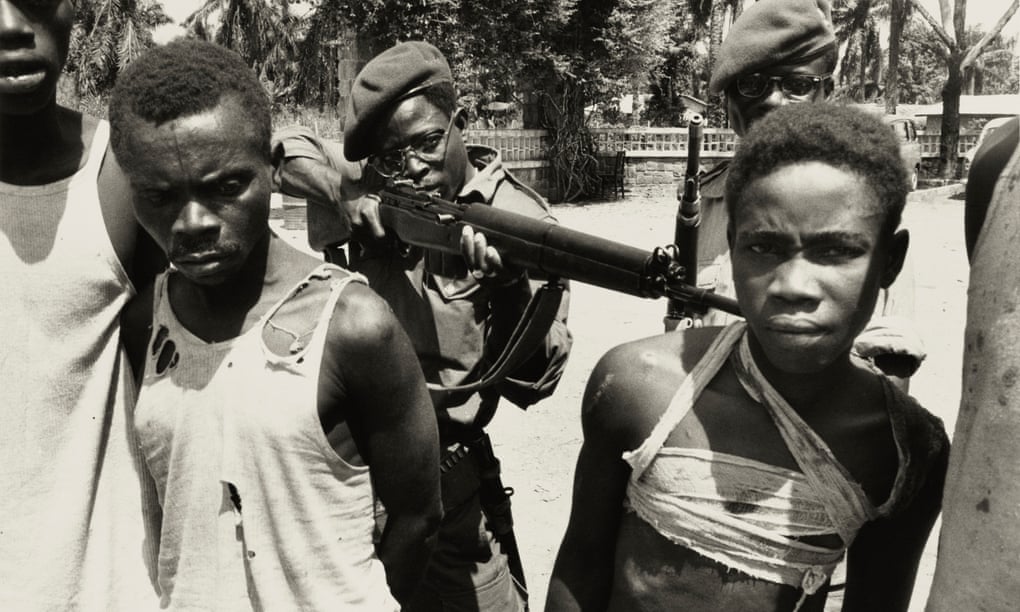 Suspected Lumumbist freedom fighters being tormented before execution, Stanleyville, 1964.