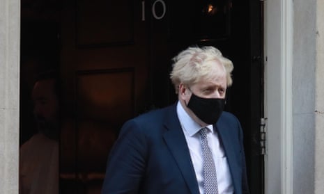 Boris Johnson leaves Downing Street on his way to parliament on Wednesday.