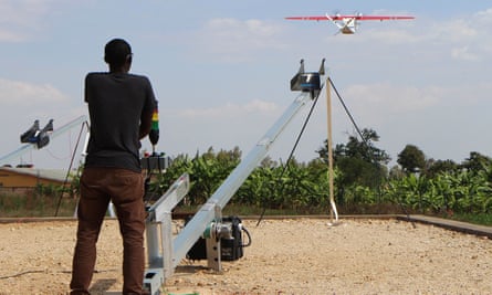 A technician of robotics company Zipline launches a drone