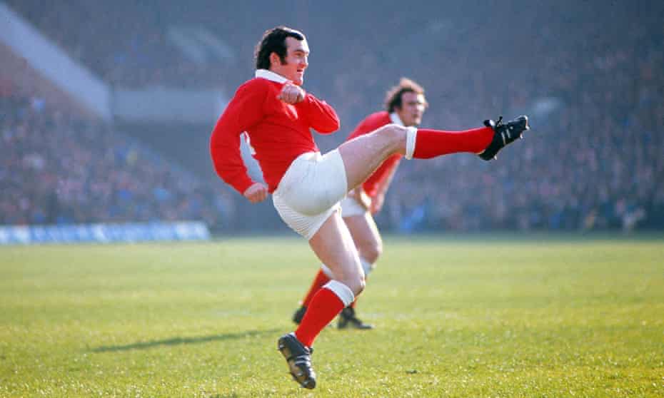 Phil Bennett kicking into touch for Wales during a 1977 match in the Five Nations against Scotland.