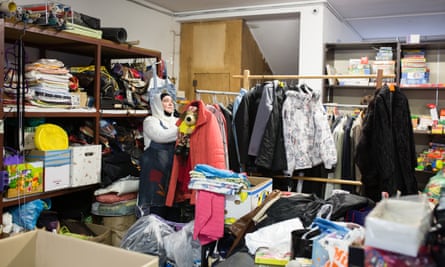 Senada inspects and stores discarded useable items in the storage of the Reuse center on May 8, 2019.