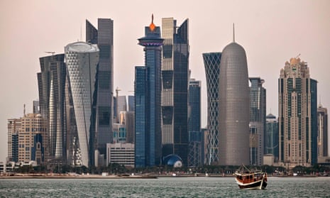 Boats moored in front of high-rise buildings in the Qatari capital, Doha. 