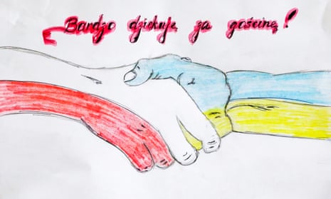 A child's drawing shows two clasped hands in the colours of Polish and Ukrainian flags and reads: ‘Thank you very much for your hospitality'