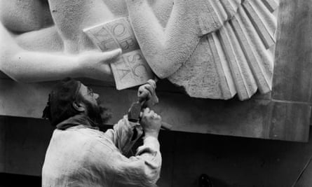 Eric Gill at work on the carvings adorning Broadcasting House in London.