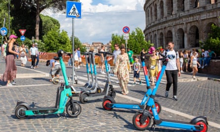 An e-scooter hire station in front of the Colosseum in Rome, Italy.